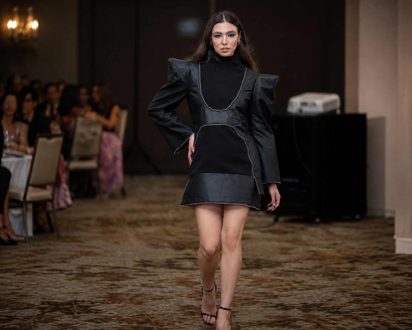 KONVETTI runway image featuring black structural dress